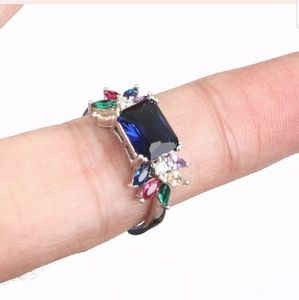 Emerald cut sapphire & floral cut gem silver ring